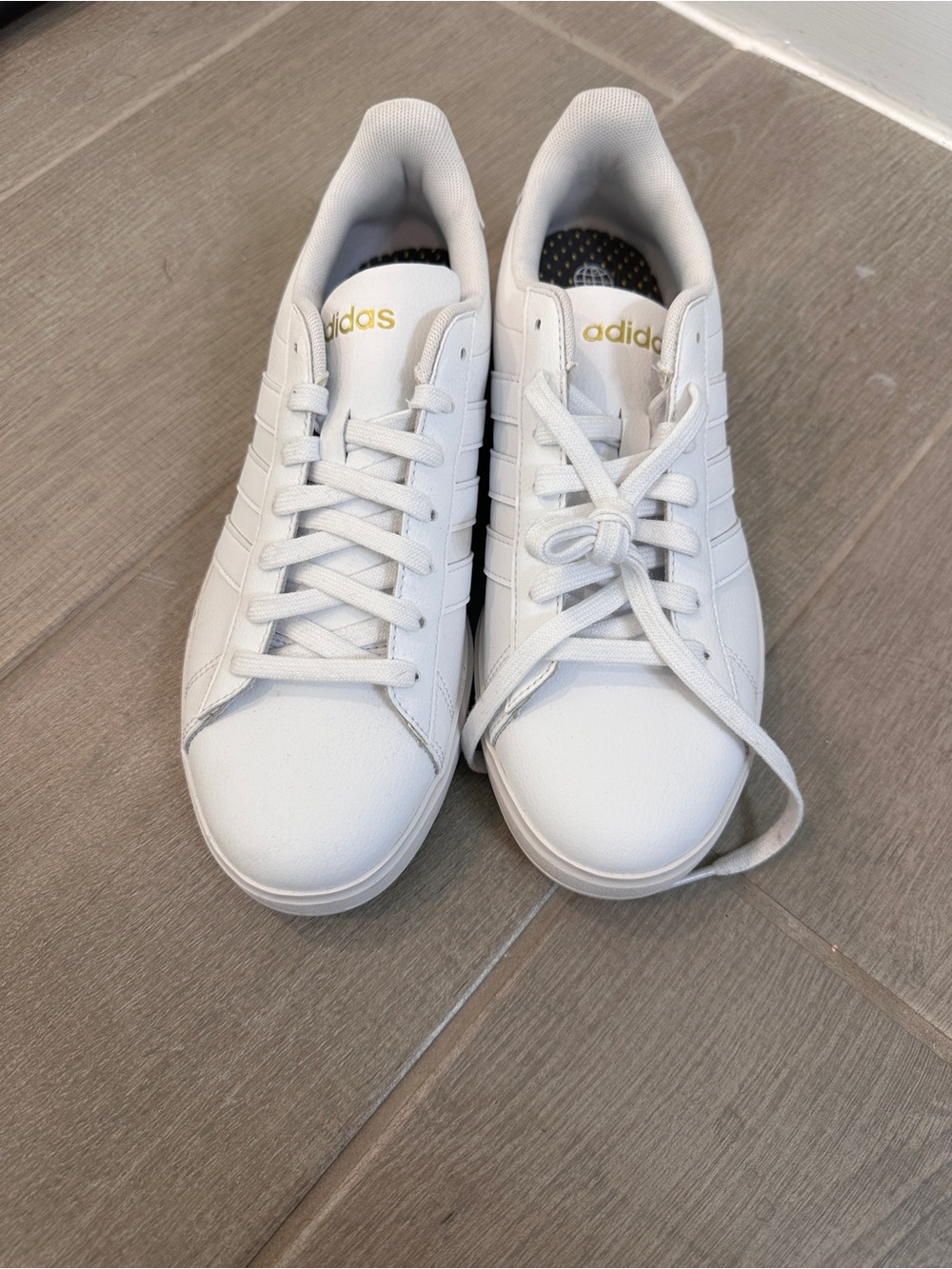 adidas White Low-Top Sneakers with Gold Accents